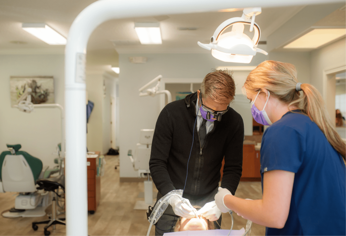 Image of Dr. Henry and an orthodontic assistant completing an orthodontic procedure