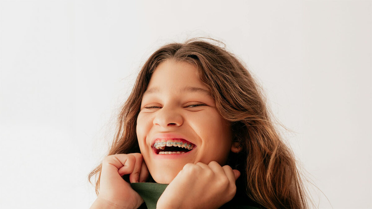 picture of a girl with braces to fix crooked teeth